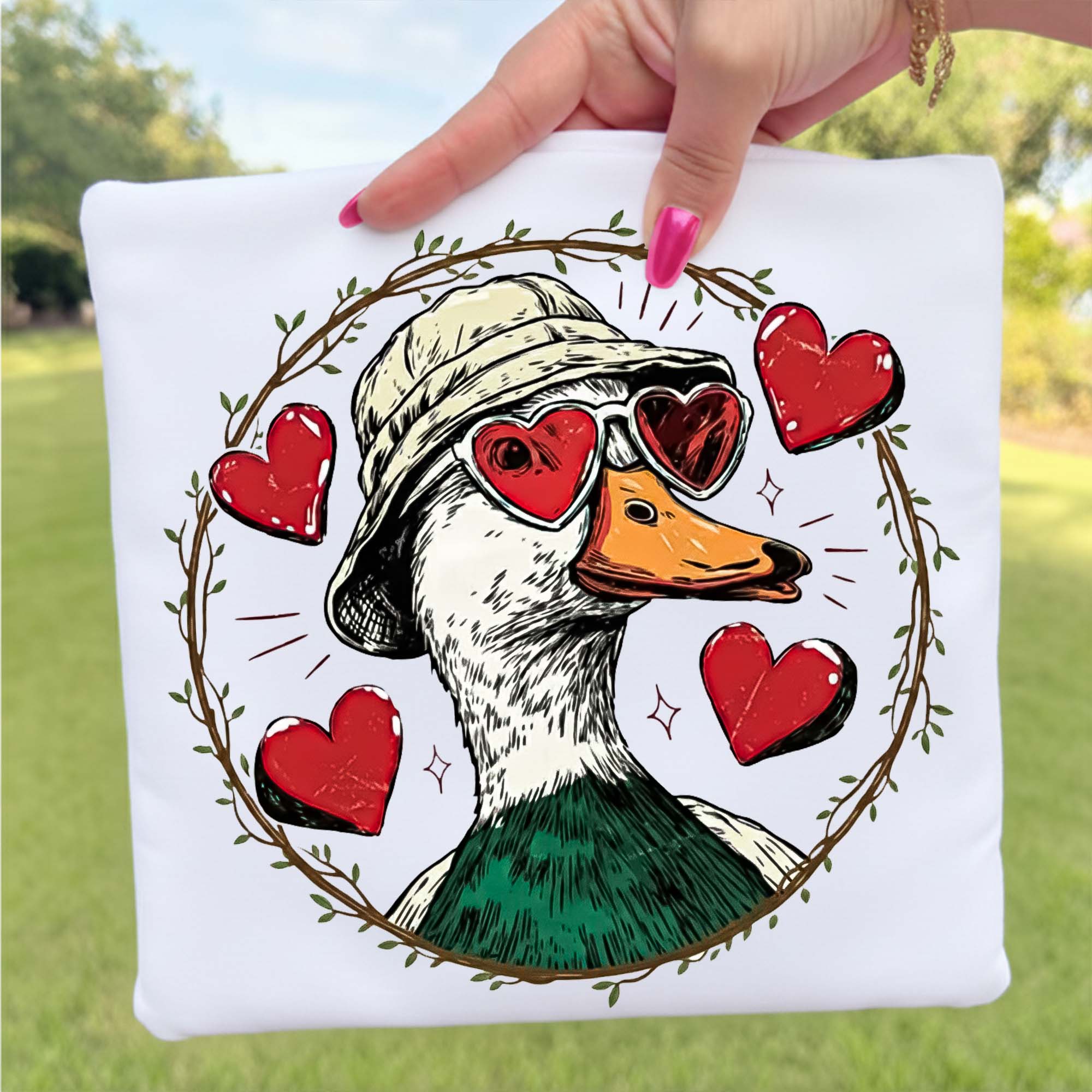 Cute Duck in Heart Wreath PNG featuring a floral duck with red hearts for sublimation, DTF transfers, t-shirts, mugs, tote bags, and digital crafting.